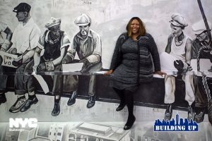 Turner-Moffatt, the Safety Diva, sitting on a steel I-beam